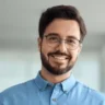 smiling-busy-young-latin-business-600nw-2392837517 smiling-busy-young-latin-business-600nw-2392837517